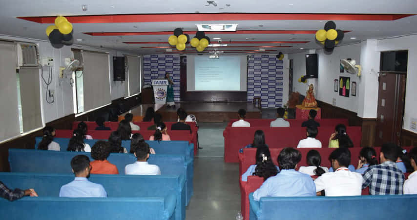 Students seated in IAMR's auditorium during a seminar session