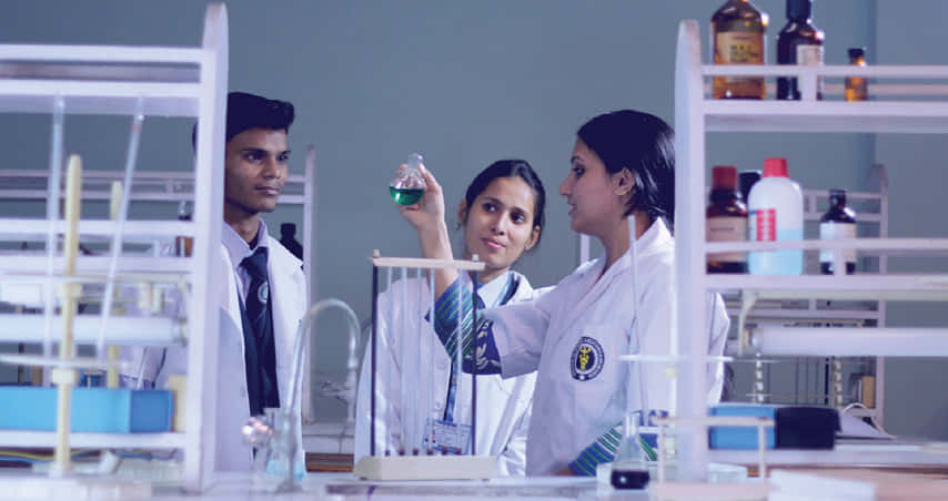 IAMR students conducting experiment in biology lab